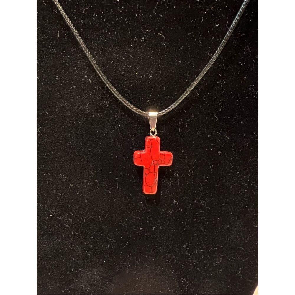 Red Stone Cross on a Black Necklace Cord